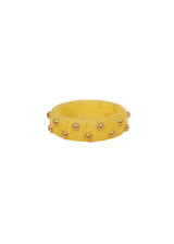 Gele bangle met gouden details