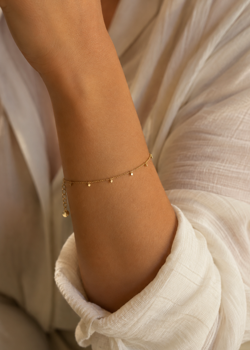 Goudkleurige armband met kleine muntjes