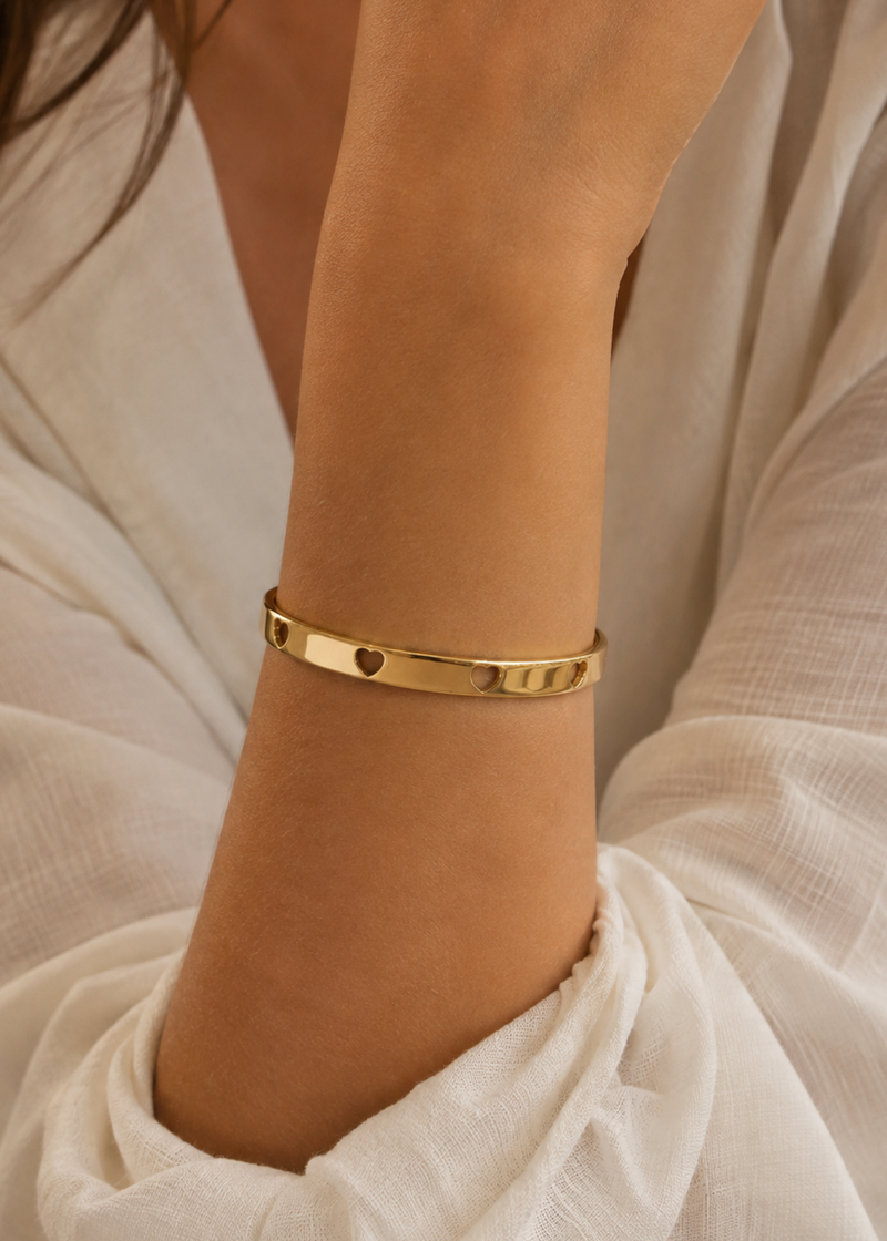 Goudkleurige verstelbare armband met hartjes